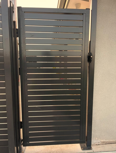 black aluminium slat single gate installed for a new build property in Clyde
