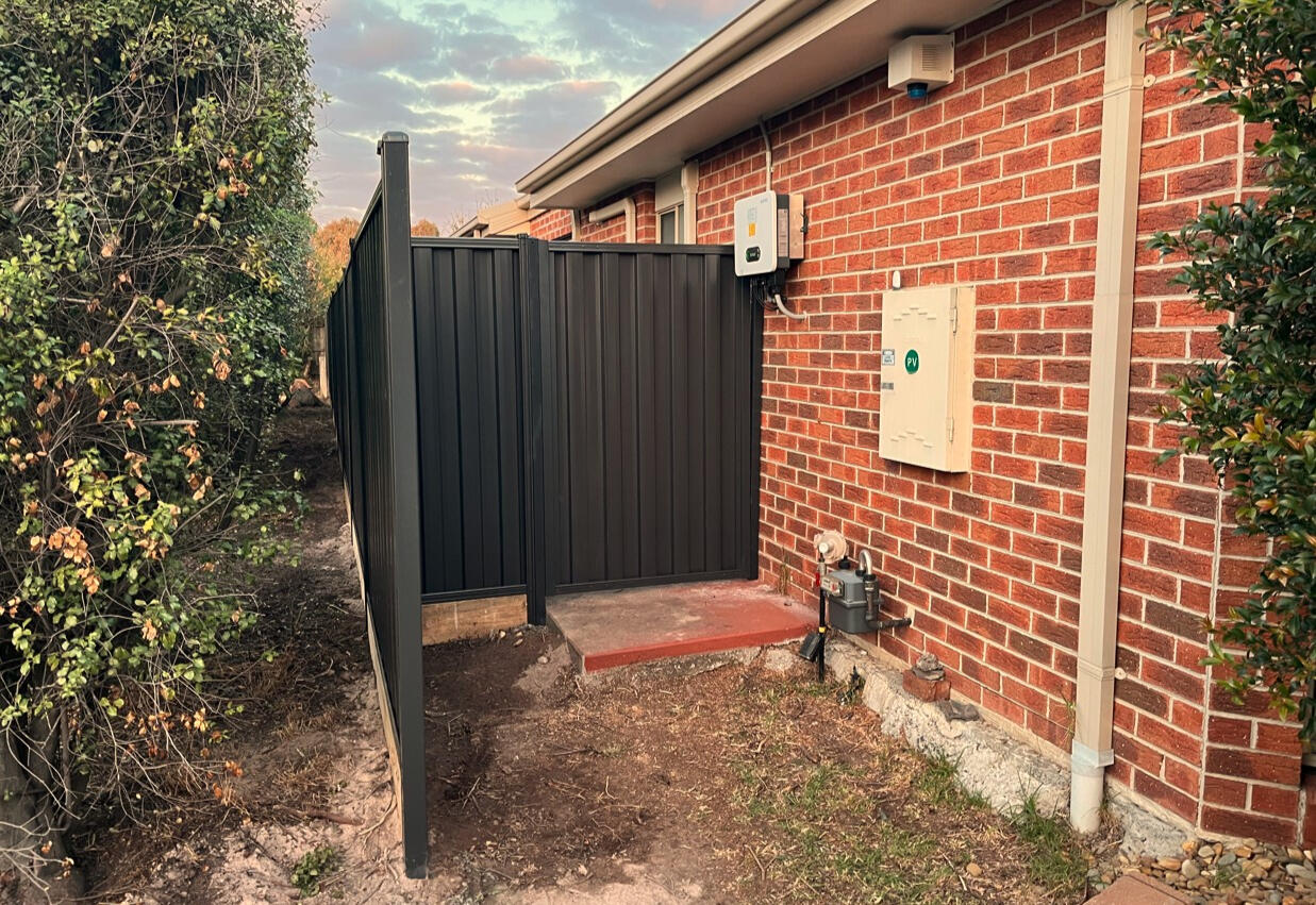 Side Gate & Fence Installation for New Estates in Clyde side gate and fence Monument with timber sleepers installed in a new estate in Clyde